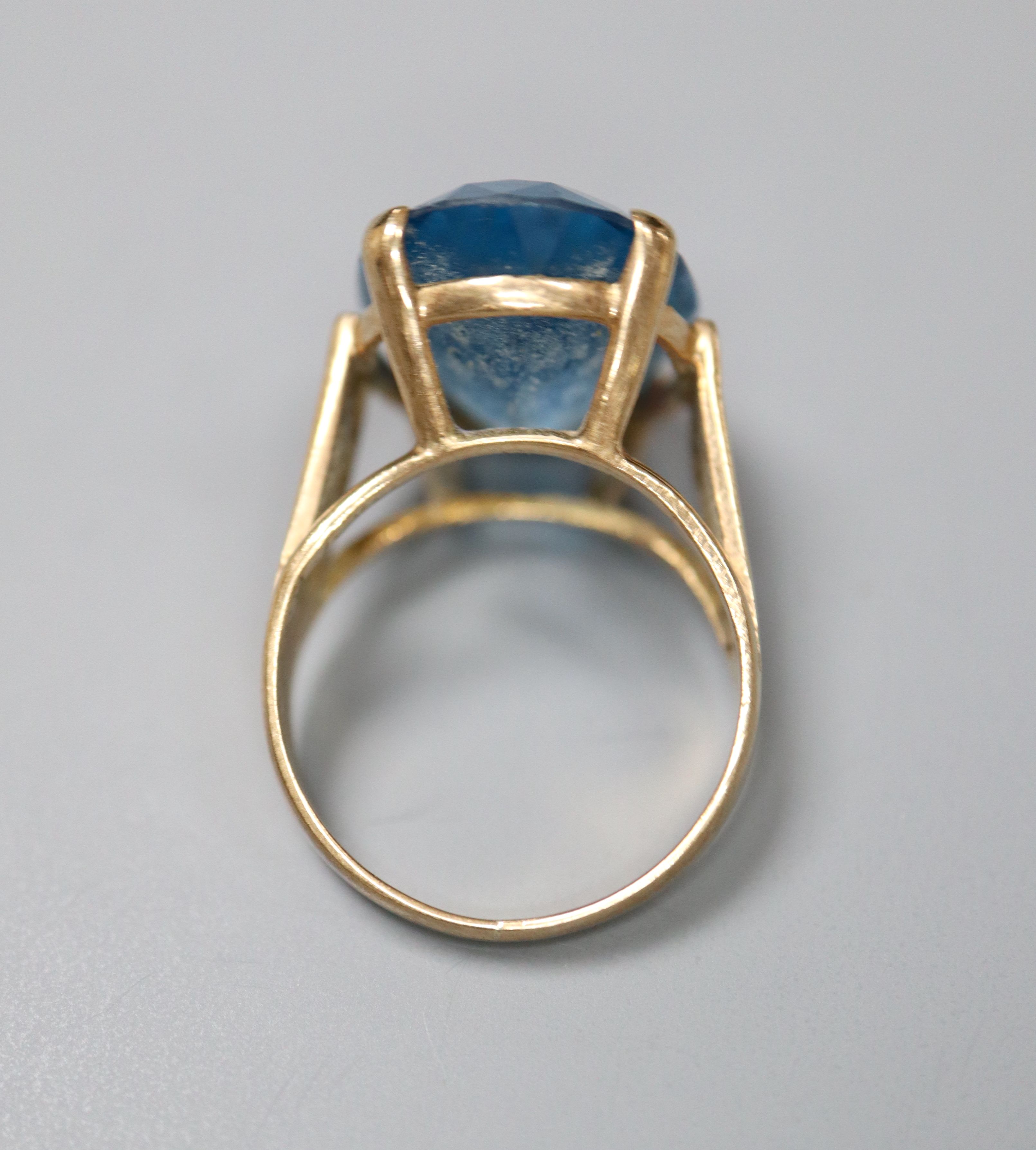 A modern 9ct god and blue paste? set oval dress ring, size K, gross 5.5 grams.